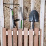 Lelands Barns corner tool caddy is a functional and stylish solution for organizing and storing tools in a shed or workshop.