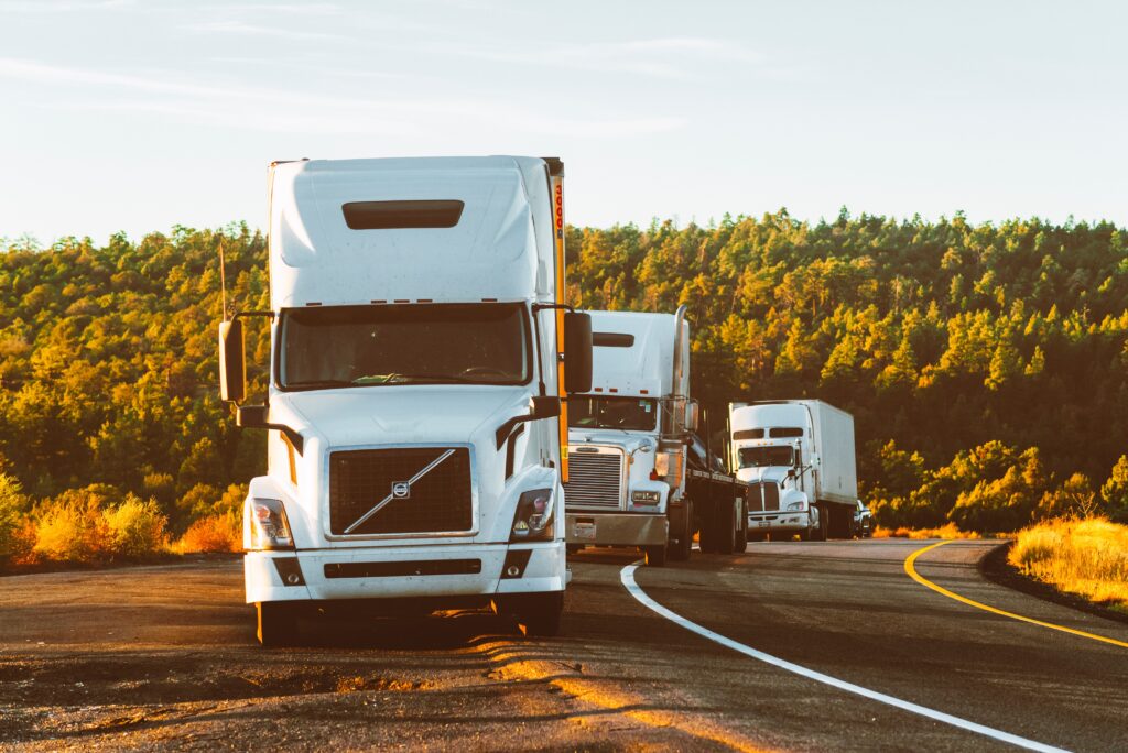 Three Tractor Trailers in Motion - Reliable and Timely Shed Delivery