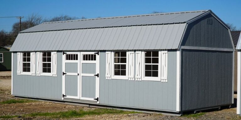 Gray lofted barn side-entry by Leland's: ample storage, loft space, and sturdy construction for all your storage needs.