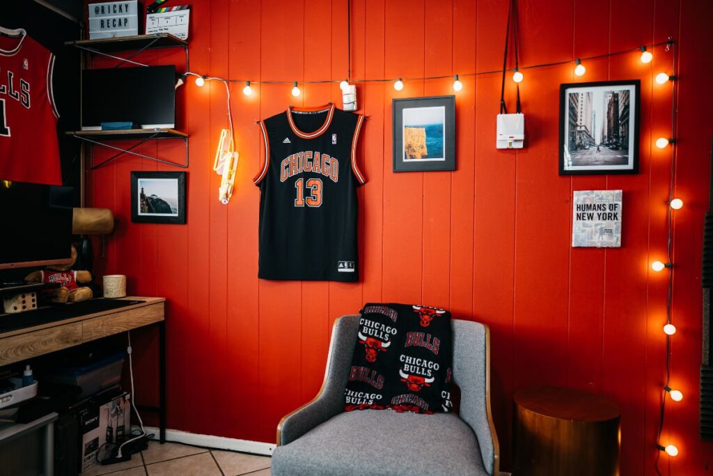 personalized red wall with frames and jerseys