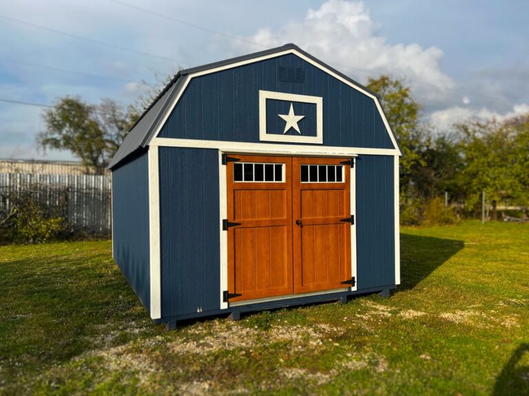 Blue lofted barn with wood-finished doors and metal roof, offering both style and function for your outdoor storage needs.