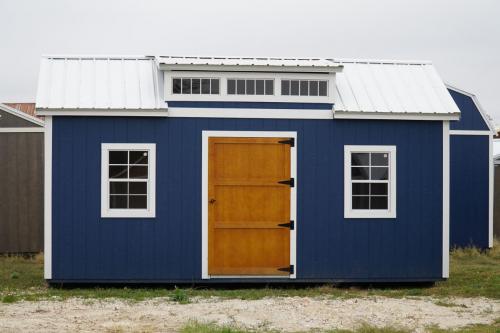 blue chalet shed with wood finished door